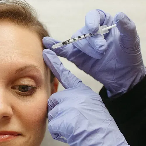 Patient receiving a cosmetic injection